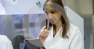 Scientist using digital tablet in laboratory 4k