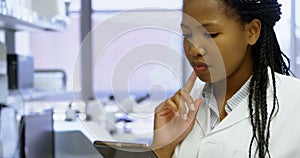 Scientist using digital tablet in laboratory 4k