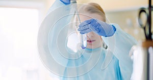 Scientist using pipette during experiment at laboratory