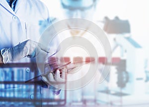 Scientist using tablet in the laboratory,Laboratory research concept,science background