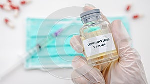 Scientist with vaccine of Covid19 in scientific chemical laboratory. Coronavirus