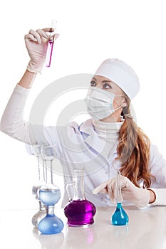 Scientist woman in lab with chemical glassware