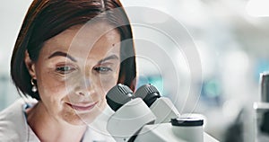 Scientist, woman and microscope at laboratory with sample for analysis of bacteria, particles or test for research