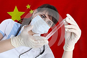 Scientist woman with test tube Coronavirus or COVID-19 against China flag. Research of viruses in laboratory