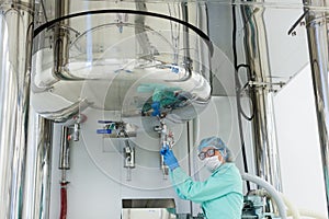 Scientist work with high-pressure tank