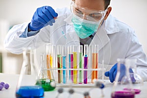 Scientist work research and analyses content of test tubes