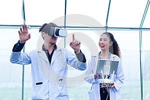 Scientist or worker use remote controller piloting drone at Garden vegetable lab for checking Plants. Scientist use remote control