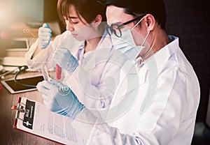 Scientist working with doctor