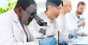 Scientist working in lab. Doctors making medical research. Biotechnology, chemistry, science, experiments and healthcare