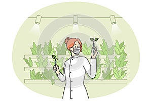 Scientist working with plants in greenhouse