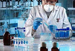 Scientist working in the research laboratory photo