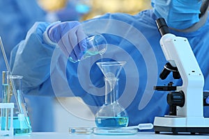 Scientist working with sample in laboratory, closeup. Medical research