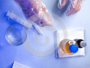 Scientist works with harmful chemicals. A laboratory worker examines biologically hazardous liquids, hazardous work, chemistry.