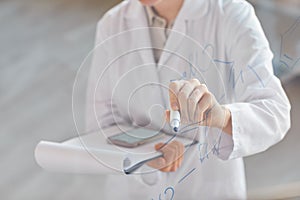 Scientist Writing on Glass Wall Close Up