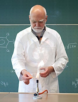 Scientists with a Bunsen burner in a lab