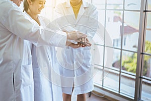 Scientists coordinate hands,Group of diversity people teamwork in laboratory,Successful and reserch working photo