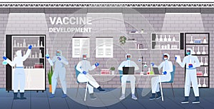 scientists developing vaccine to fight against coronavirus researchers working in lab vaccine development