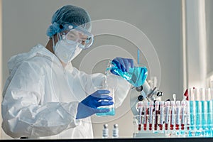 Scientists do experiment to research the covid-19 virus vaccine in a medical laboratory. A doctor uses biotechnology to research