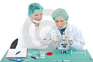 Scientists females using microscope