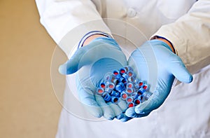 Scientists hand holds disposable caps