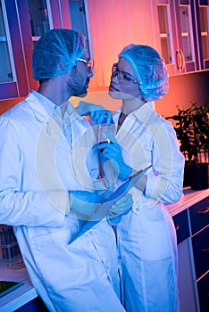 Scientists having office romance at laboratory