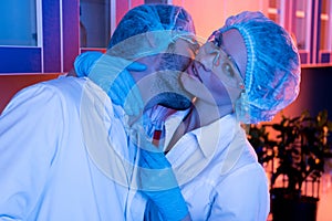 Scientists having office romance at laboratory