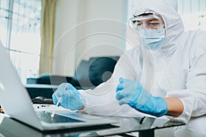 Scientists use Cotton Bat for keep and checking and testing virus on labtop at home