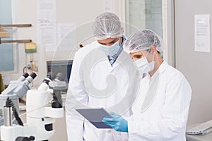 Scientists using tablet