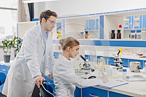 Scientists working in laboratory