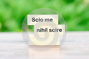 Scio me nihil scire It is translated from Latin as I know I don't know anything. written on wooden blocks photo