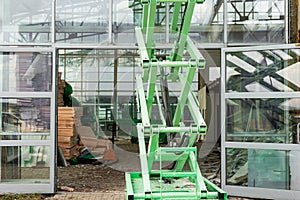 Scissor Lift Platform  with hydraulic system at a construction site.