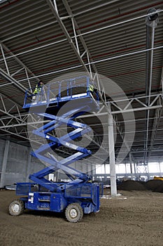 Scissor lift platform inside industrial building