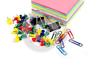 Scissor, tacks, papers and paper clips on white background