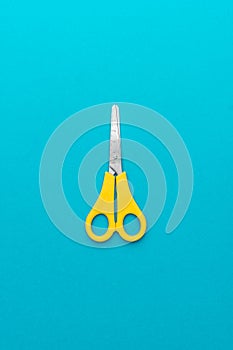 Scissors on the blue background