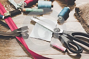 Scissors, bobbins with thread and needles
