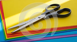 Scissors on Colored Paper Stack