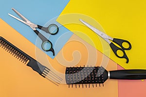 Scissors and comb. Barber scissors for cutting hair on a colored background. Hairdressing equipment concept, hairdressing set.