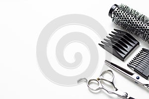 Scissors and comb on a white background, copy space