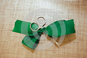 Scissors cut green silk ribbon