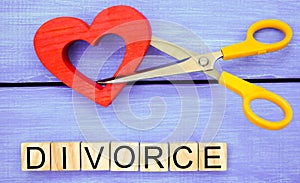 scissors cut heart. the inscription `divorce`. the concept of breaking relations, quarrels. treachery, betrayal. cancellation of m