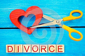 Scissors cut heart. the inscription `divorce`. the concept of breaking relations, quarrels. treachery, betrayal. cancellation of m