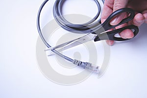 Scissors cut internet cable. Internet shutdown. Cut internet cable.
