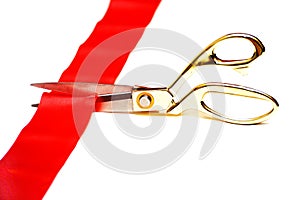 Scissors cut a red tape