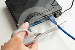 Scissors cut the router cables.