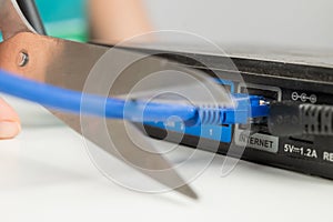 Scissors cut the router cables.