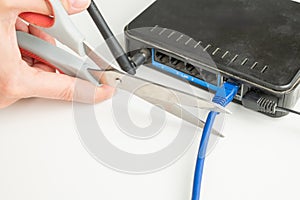 Scissors cut the router cables.