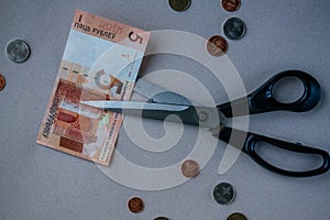 Scissors cuts one Belarusian ruble note