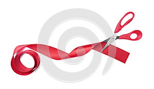 Scissors cuts red ribbon.