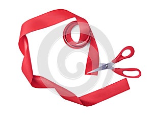 Scissors cuts red ribbon.