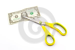 Scissors cutting dollar. photo